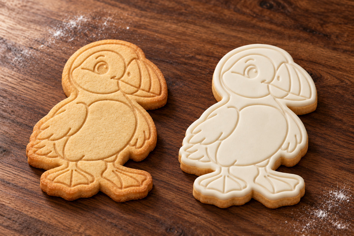 Puffin cookie cutter and embosser set – plain cookie and white fondant cookie examples