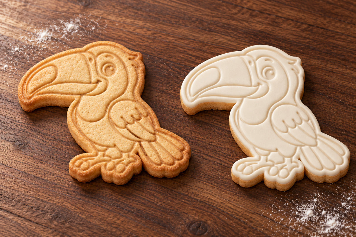 Toucan cookie cutter and embosser set – plain cookie and white fondant cookie examples