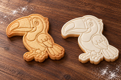 Toucan cookie cutter and embosser set – plain cookie and white fondant cookie examples