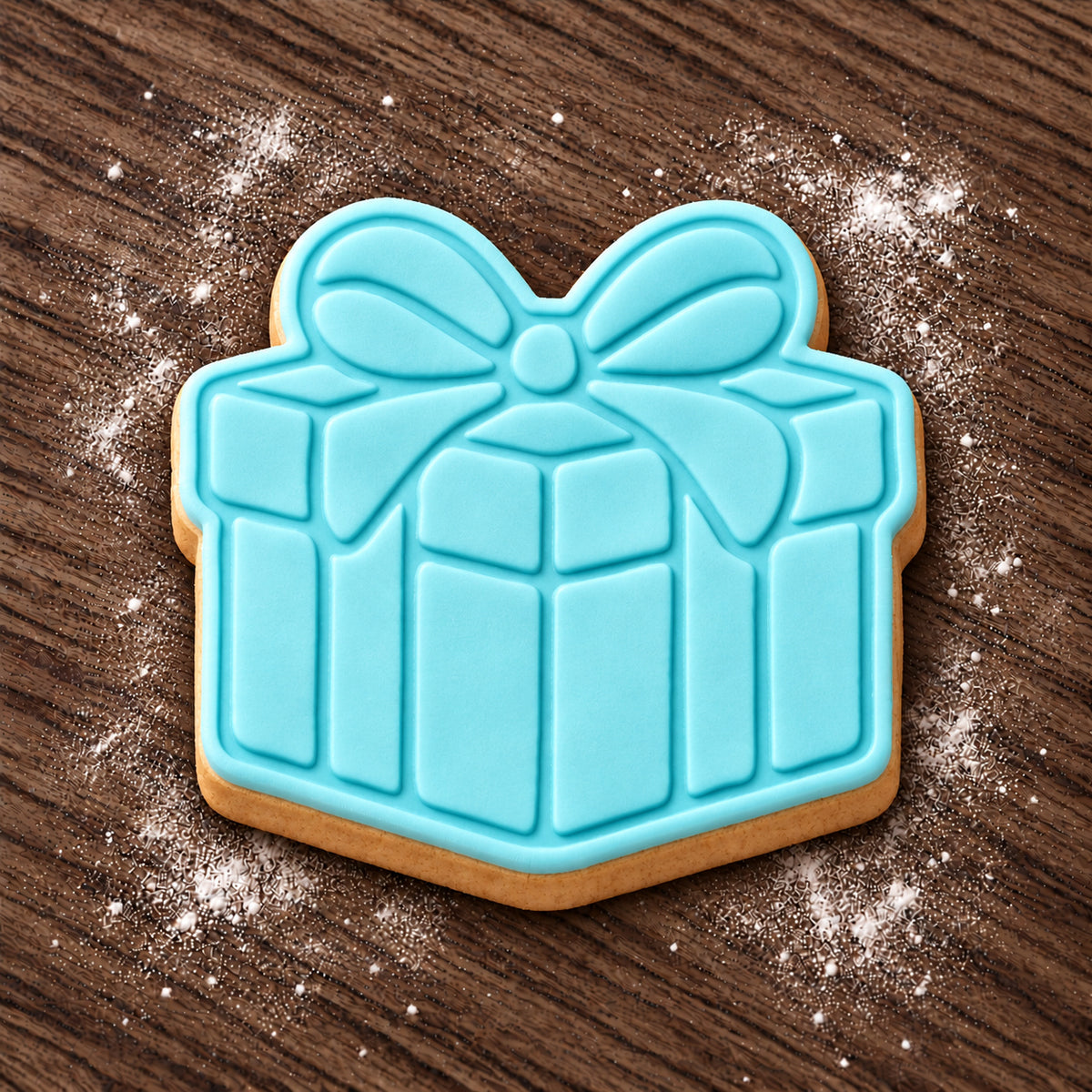 Present decorated fondant cookie