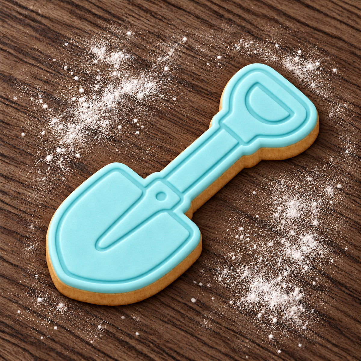Shovel decorated fondant cookie