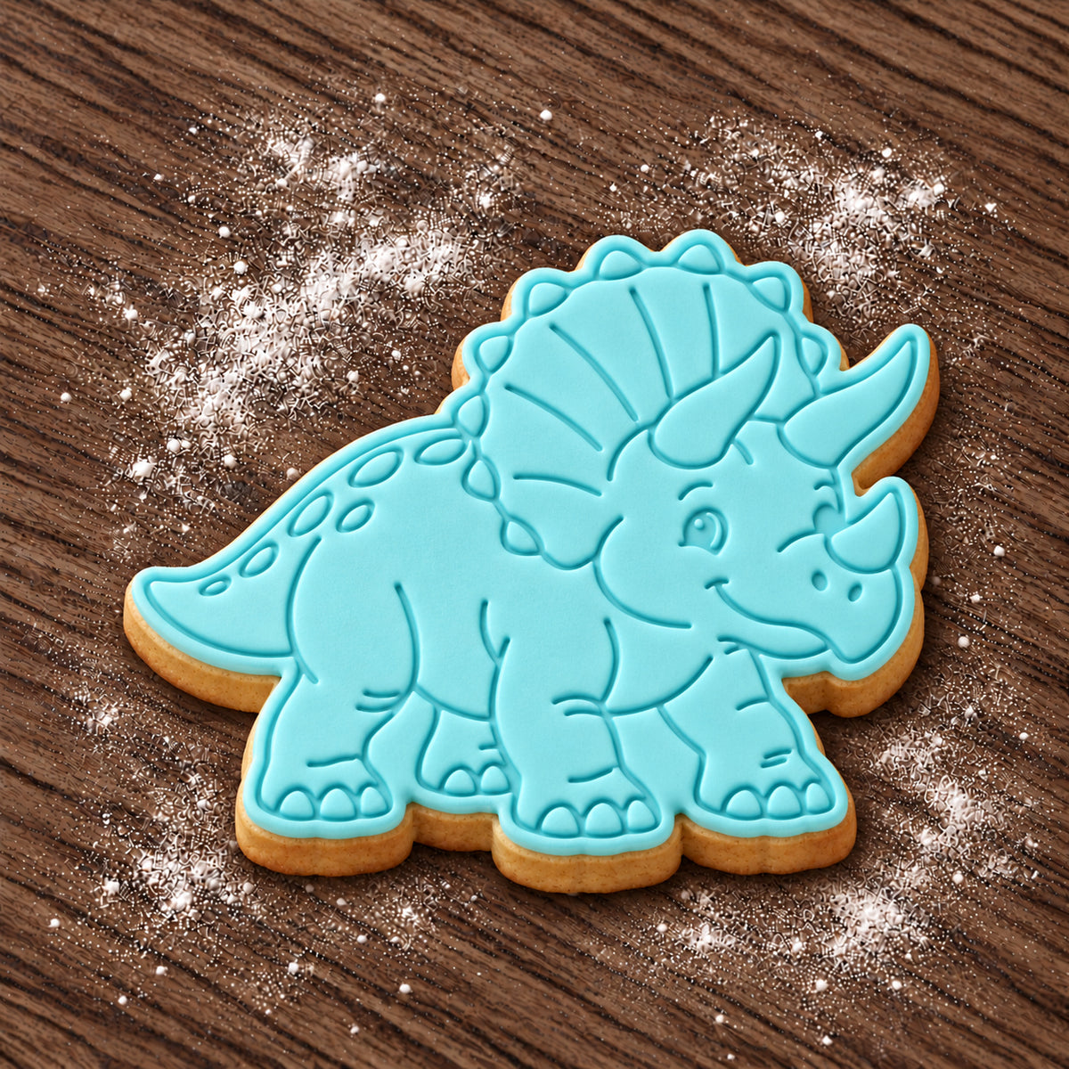 Triceratops decorated fondant cookie