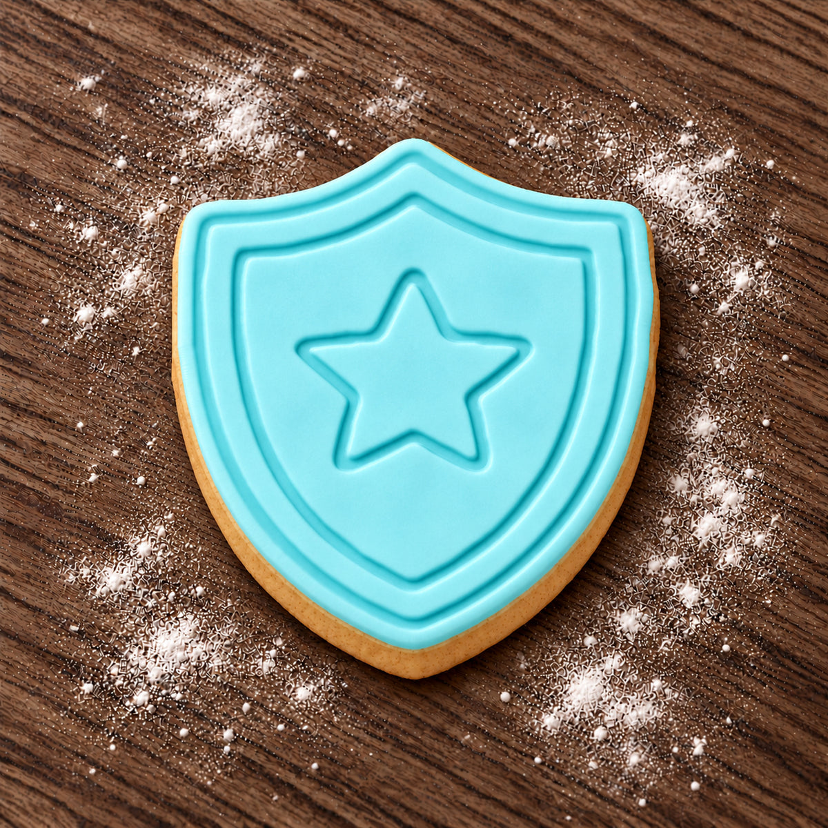 Shield decorated fondant cookie