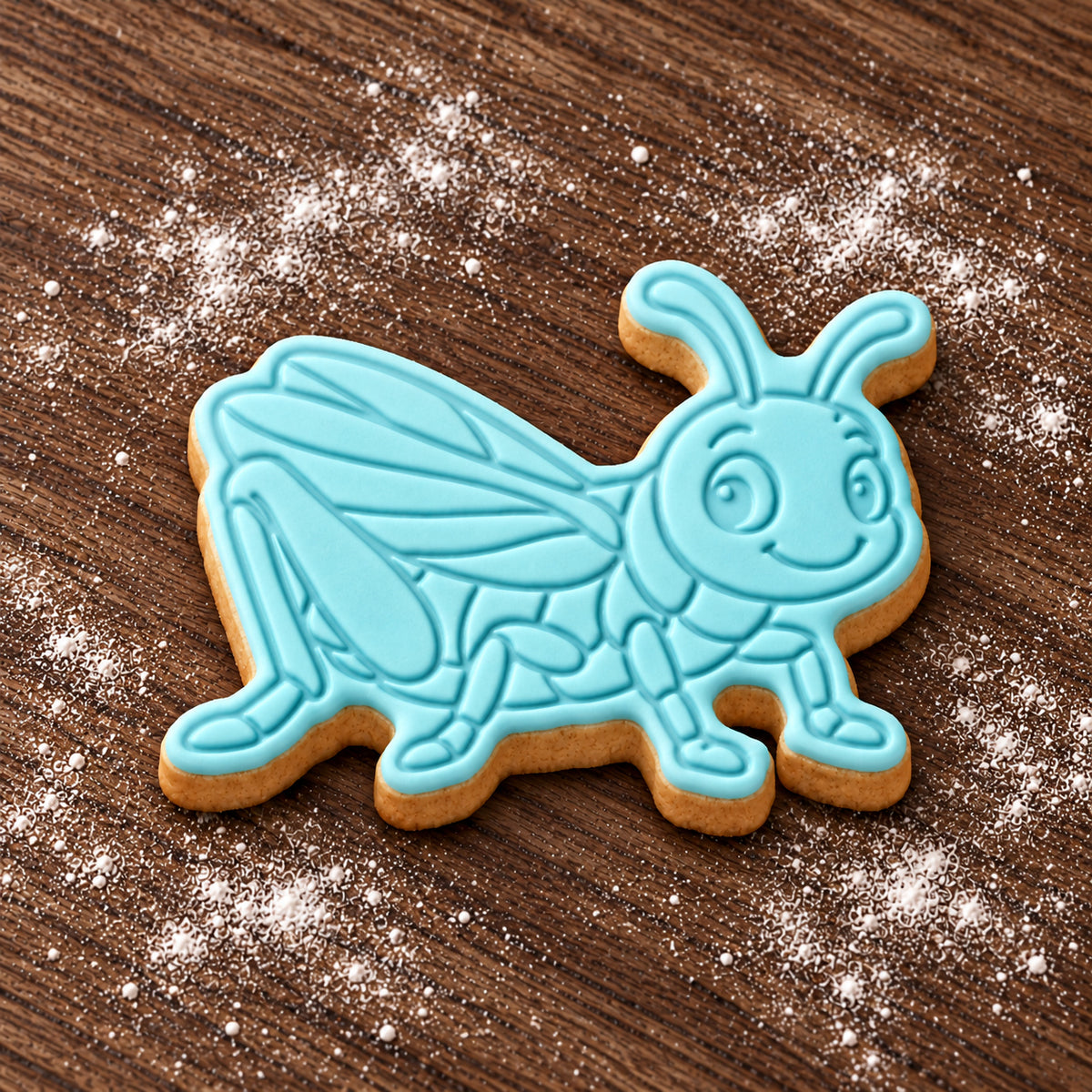 Cricket decorated fondant cookie