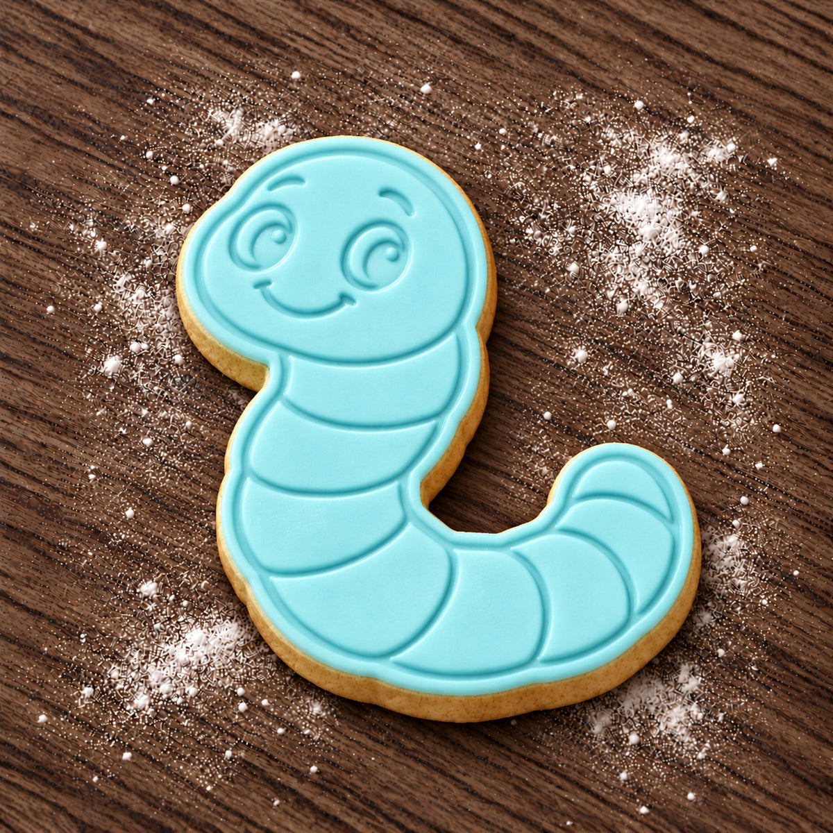 Worm decorated fondant cookie
