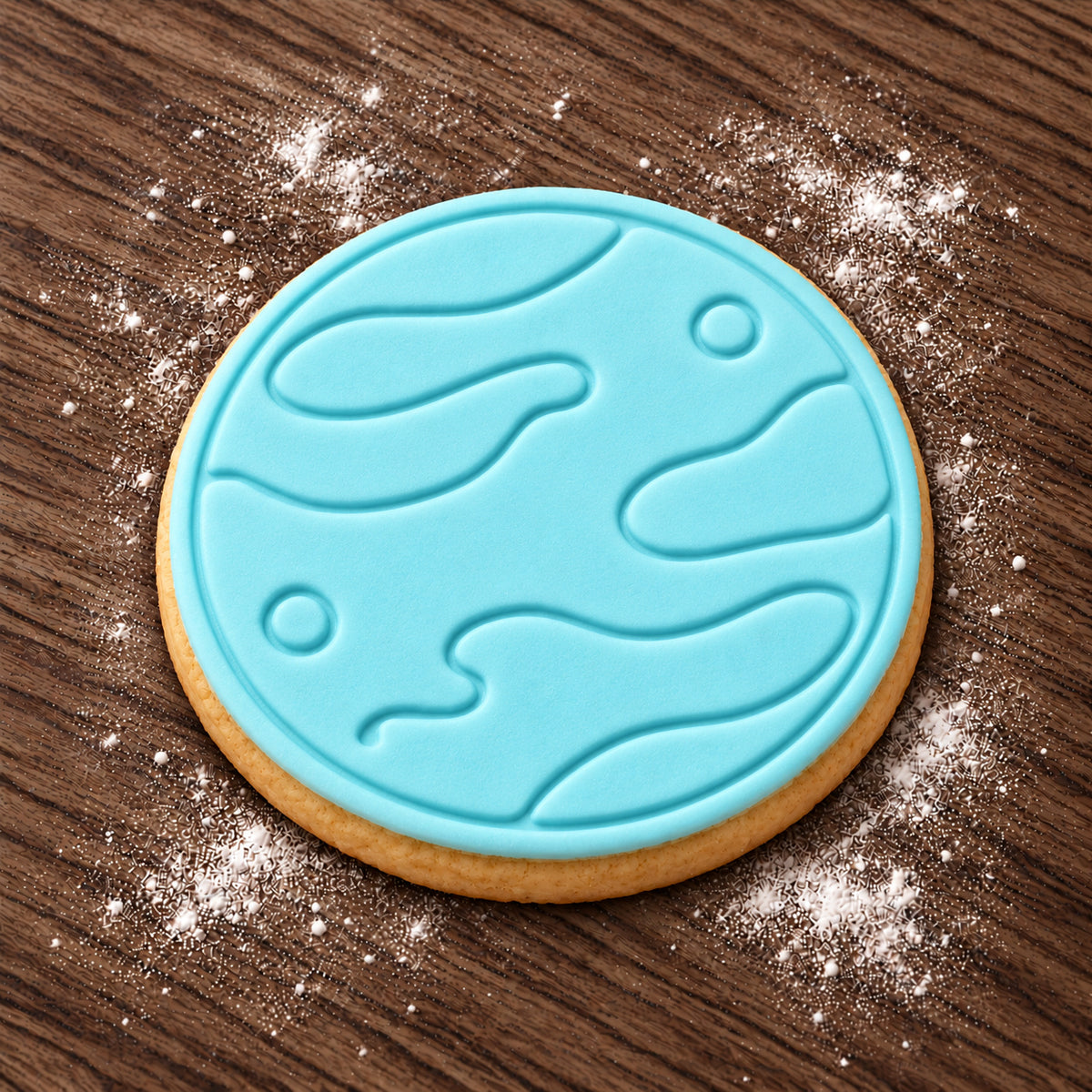 Planet decorated fondant cookie