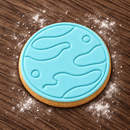 Planet decorated fondant cookie