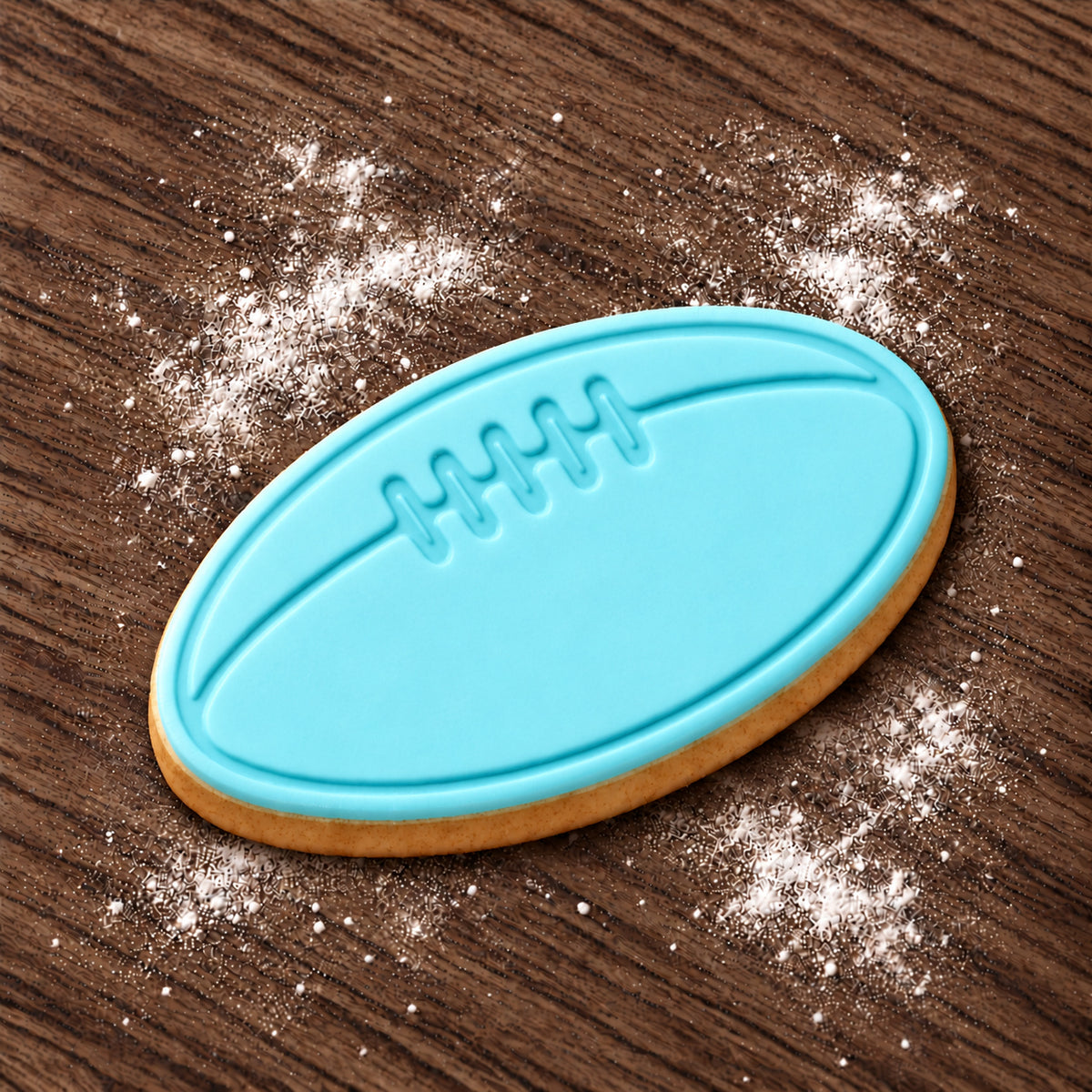 Football decorated fondant cookie