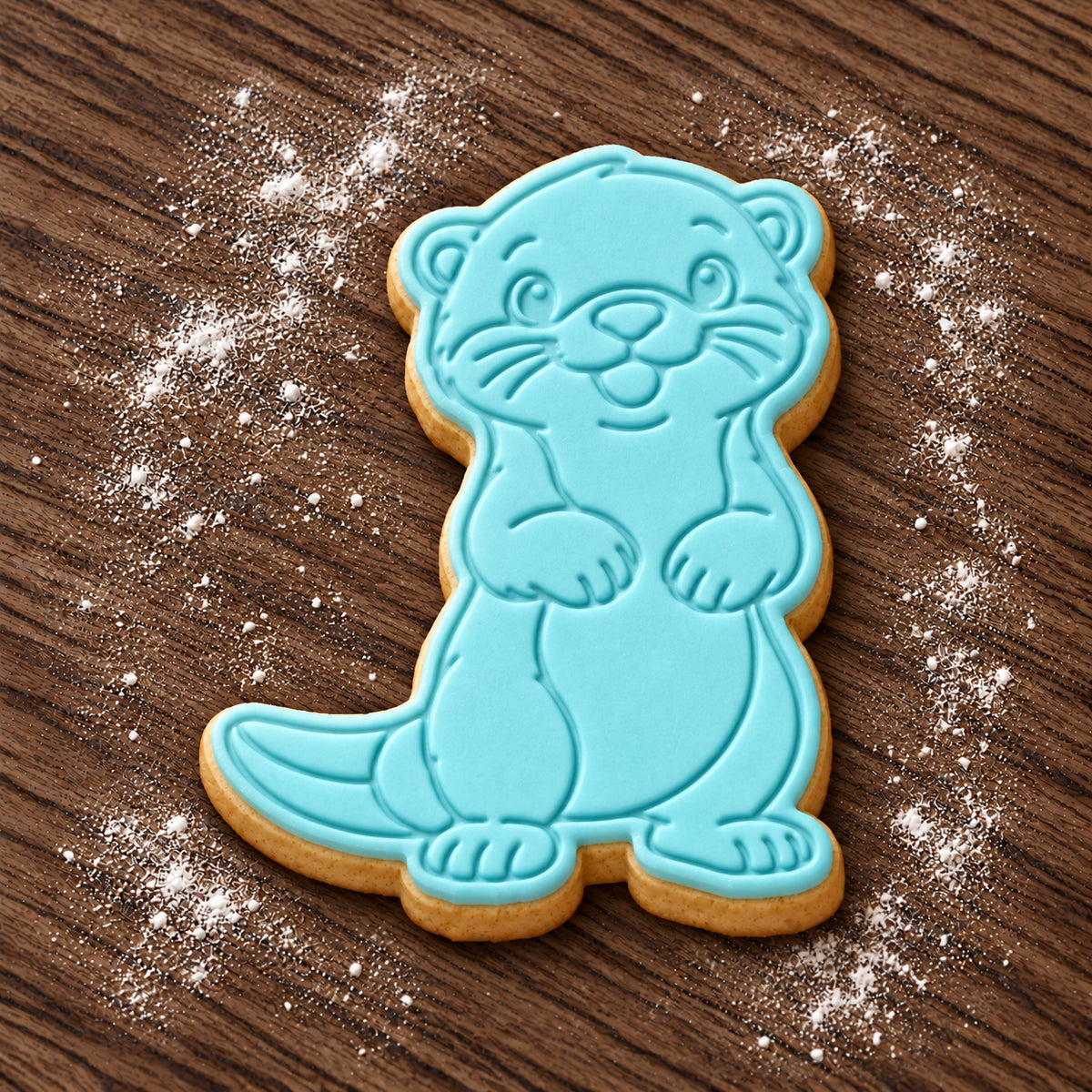 Otter decorated fondant cookie
